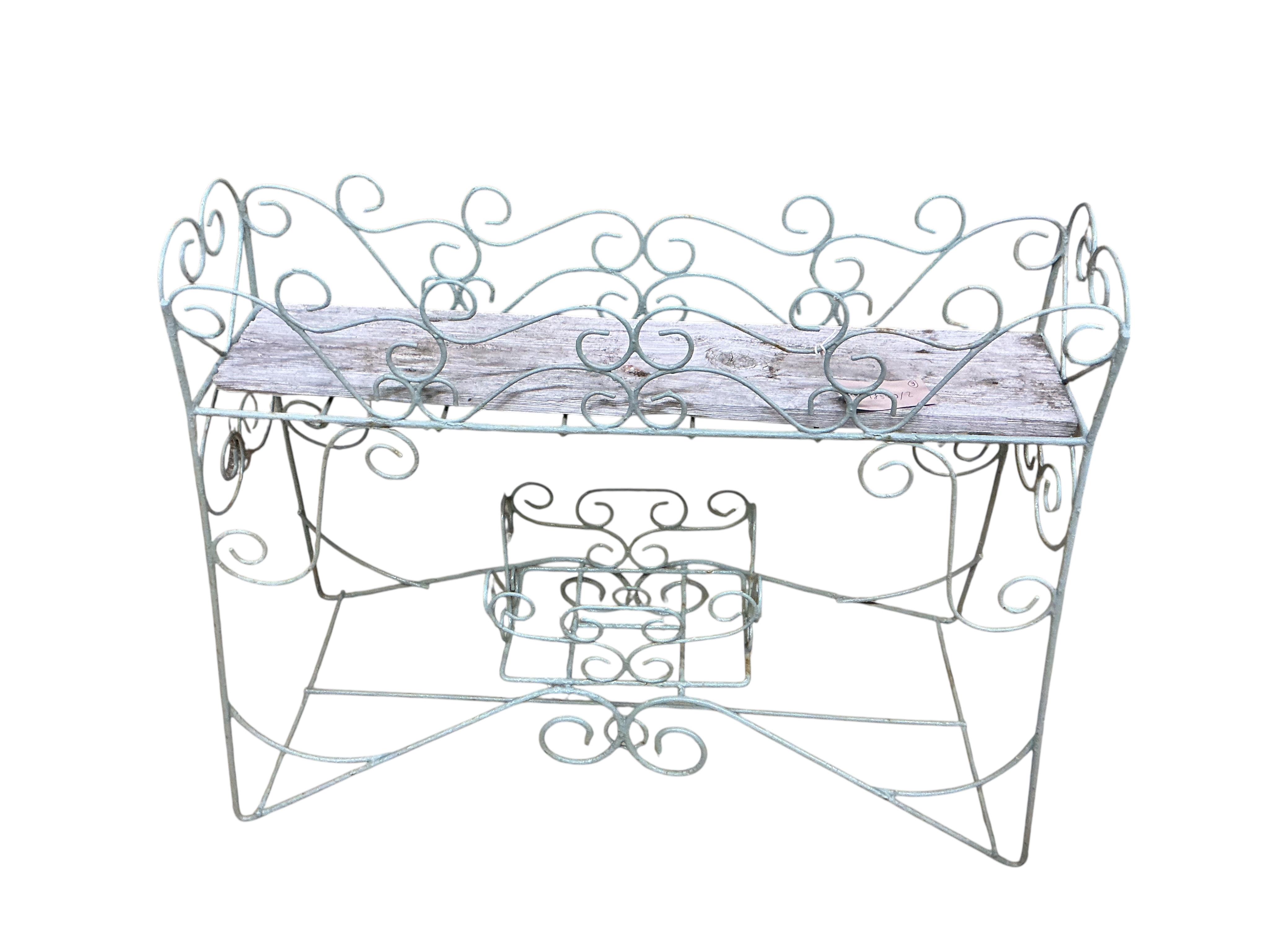 Three painted wrought pot stands, largest width 68cm, height 65cm